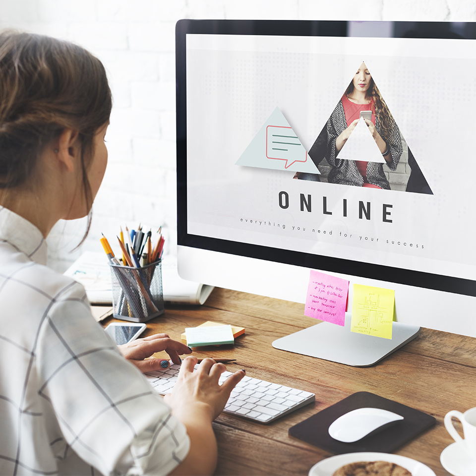 A web designer working at a computer