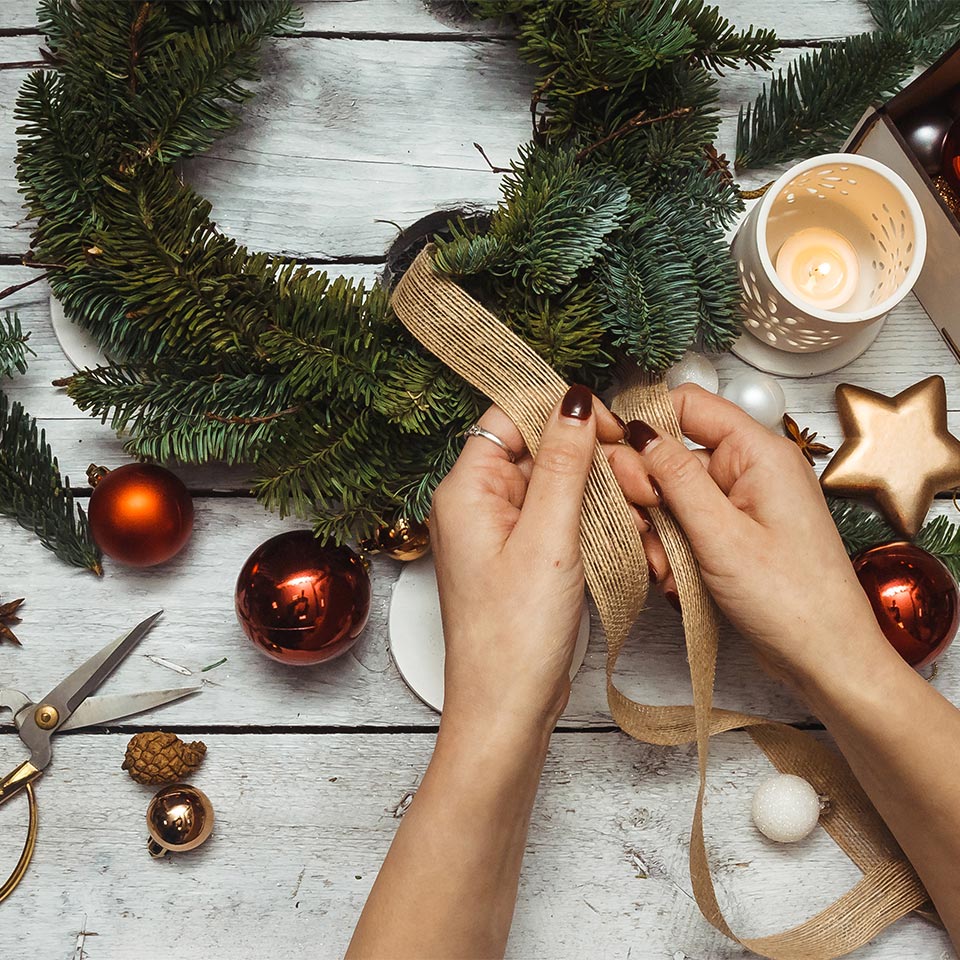 Someone making a Christmas wreath