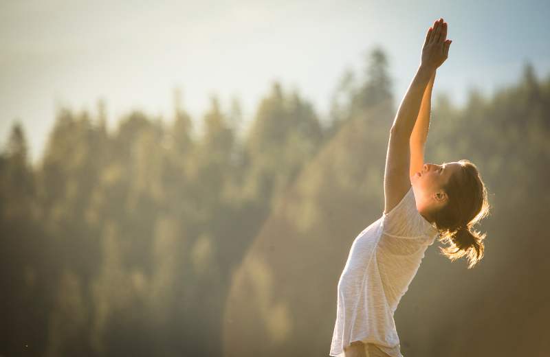 woman doing yoga outside