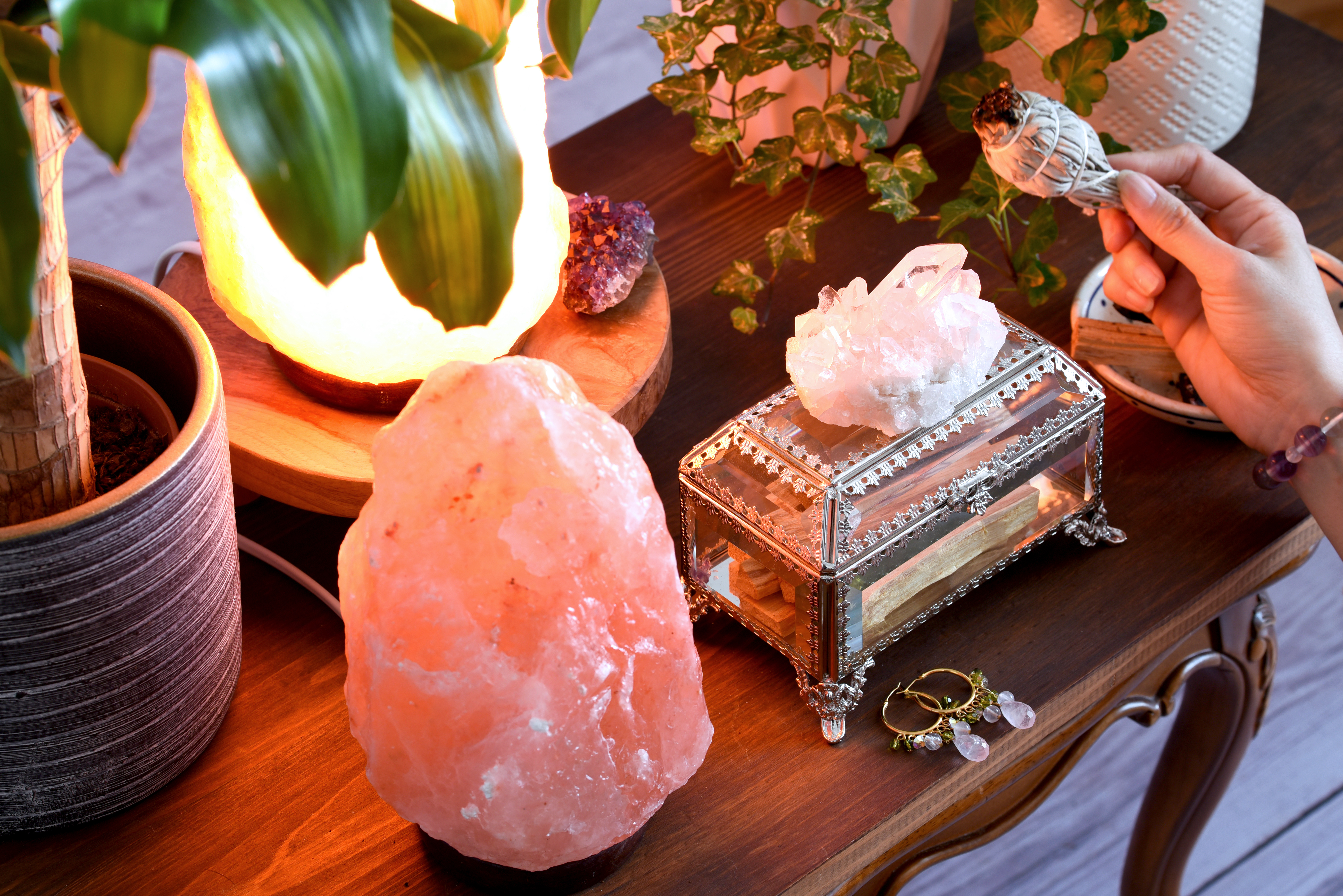 Sage, pink himalayan salt lamp and crystals