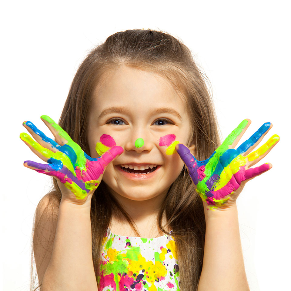 Young girl with hands painted with various colours