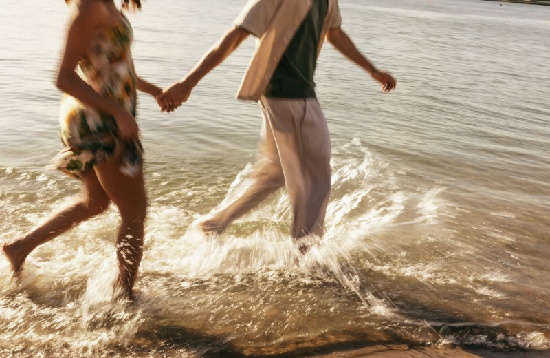 Couple walking in the sea together