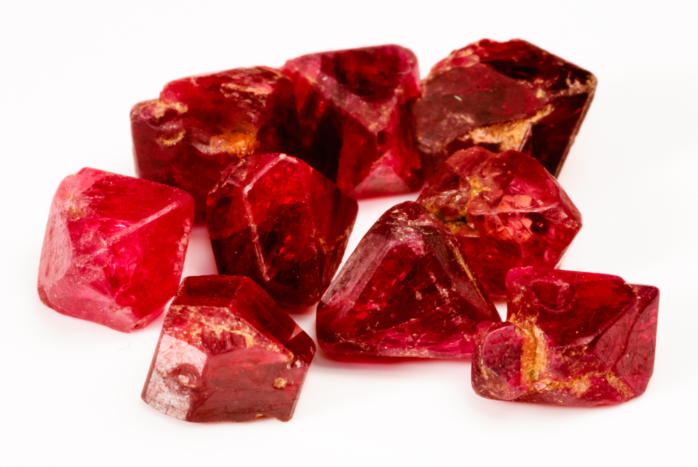 Multiple pieces of Red Spinel on a white background