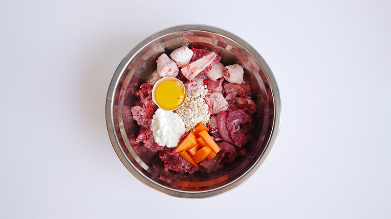 A bowl foods that make up a typical raw feeding diet