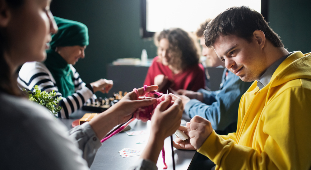 Friends knitting together