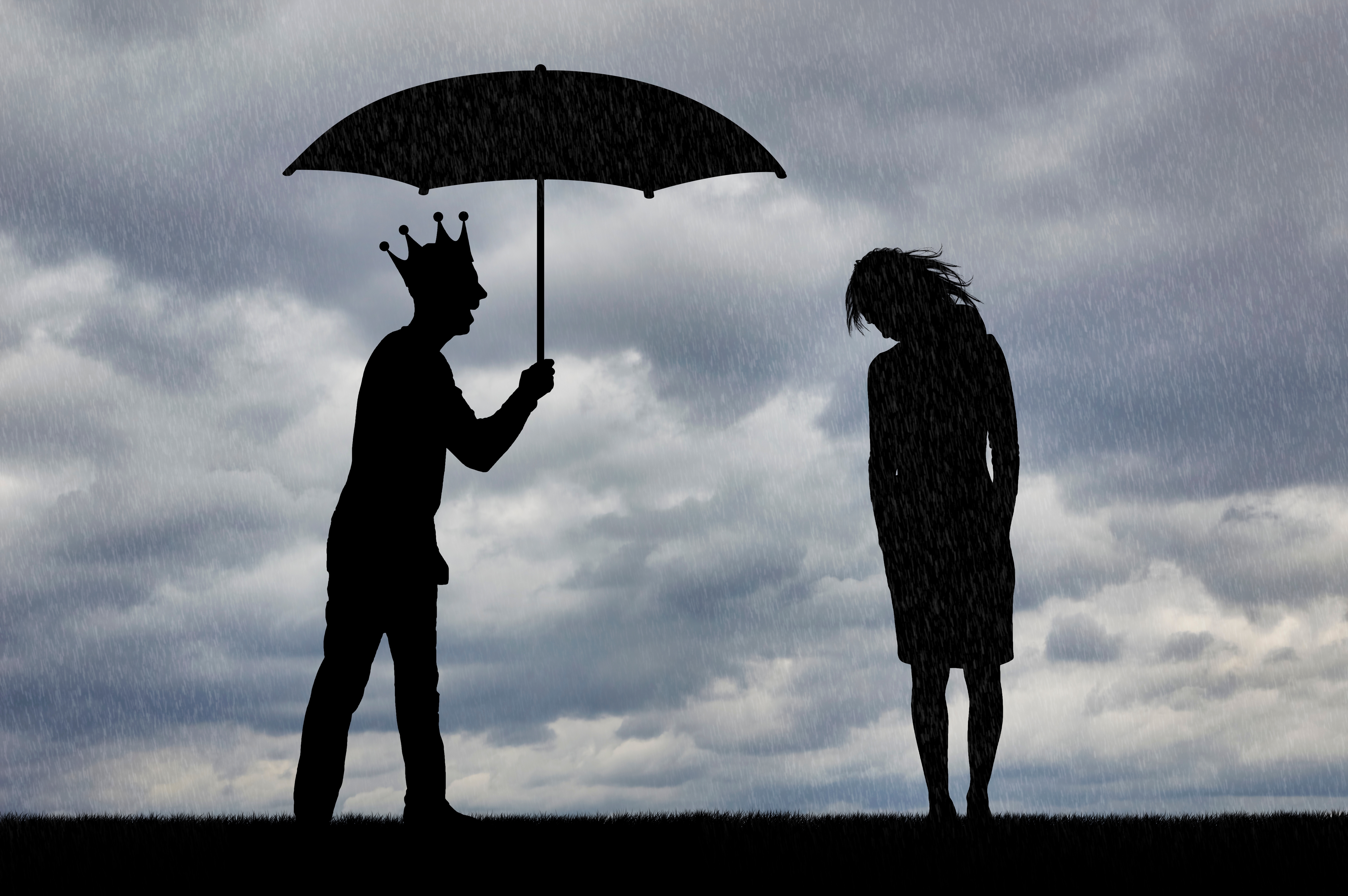 Silhouette of a sad woman and a man with a crown on and an umbrella over his head