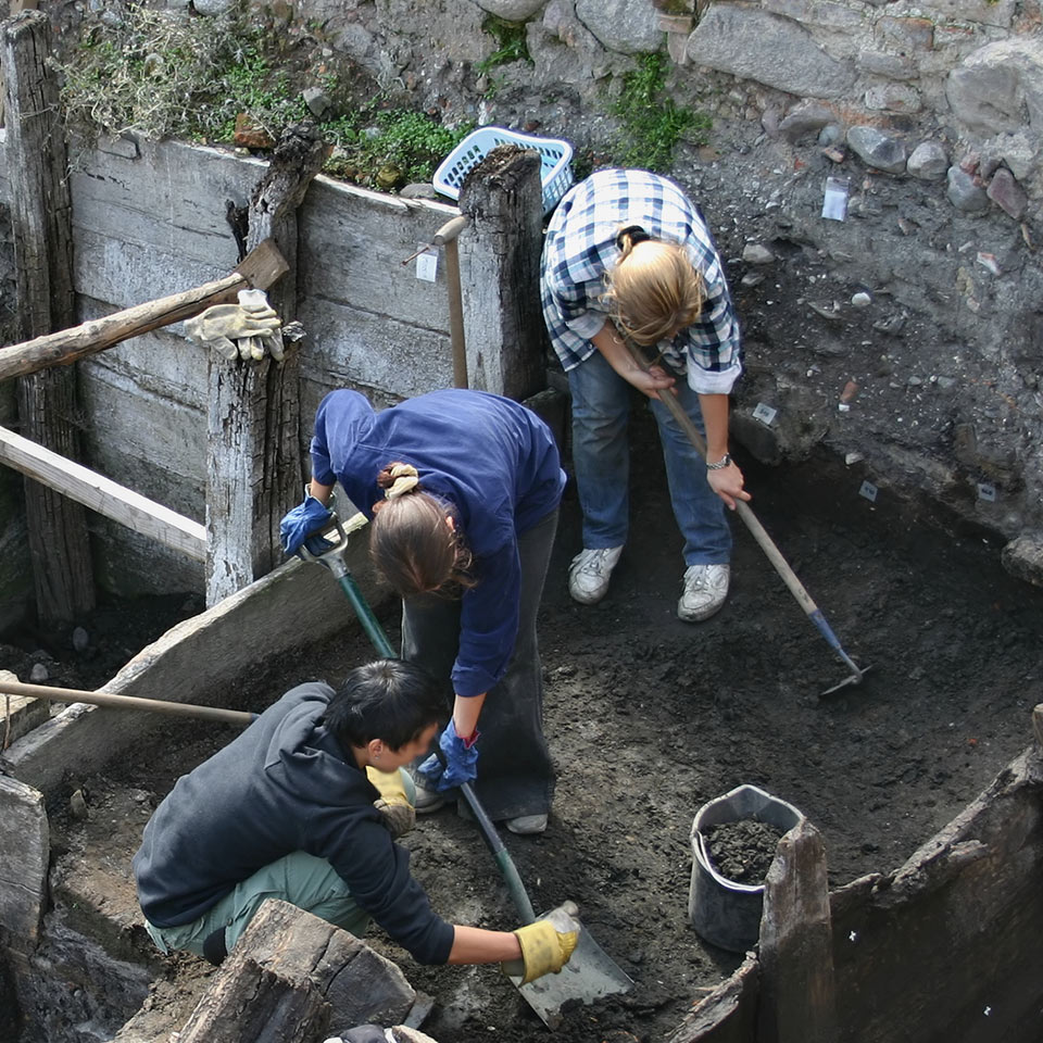 Archeologists digging at an excavation site