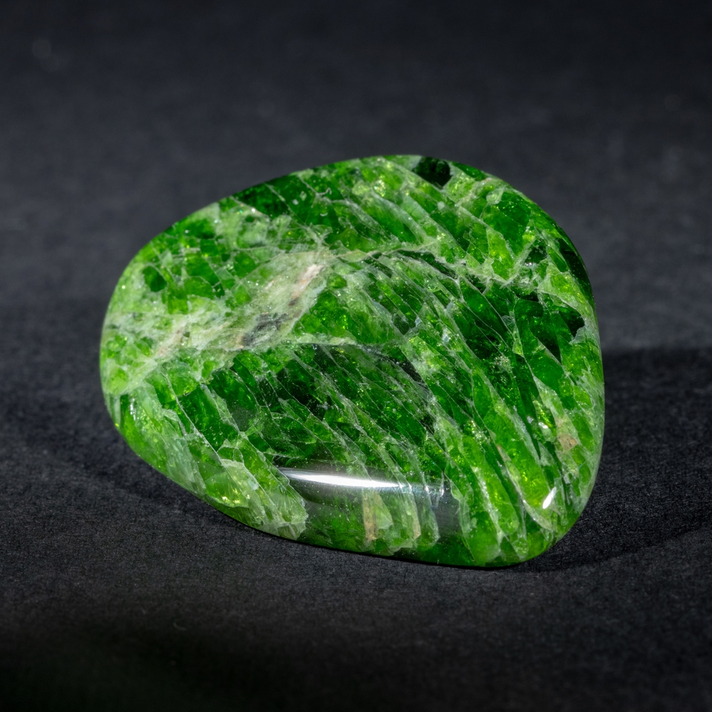 A piece of Chrome Diopside on a black background