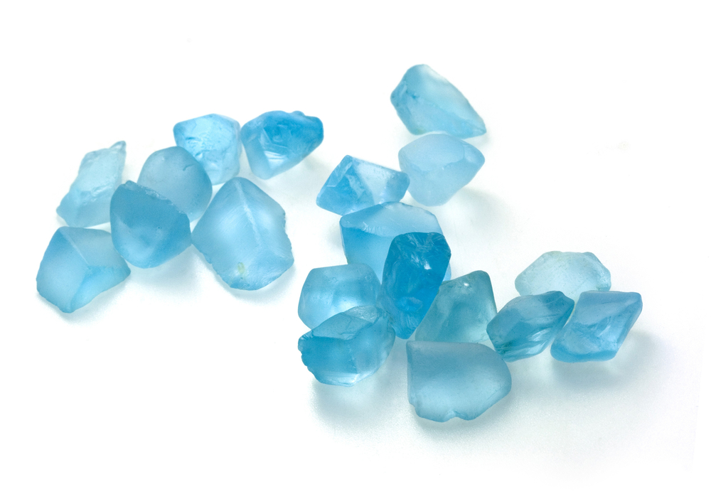 Multiple pieces of Blue Topaz on a white background