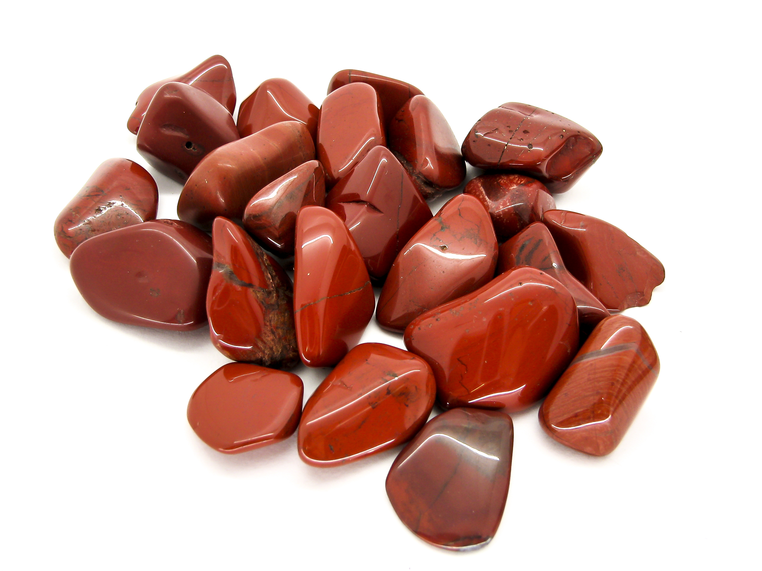 Pieces of Red Jasper on a white background