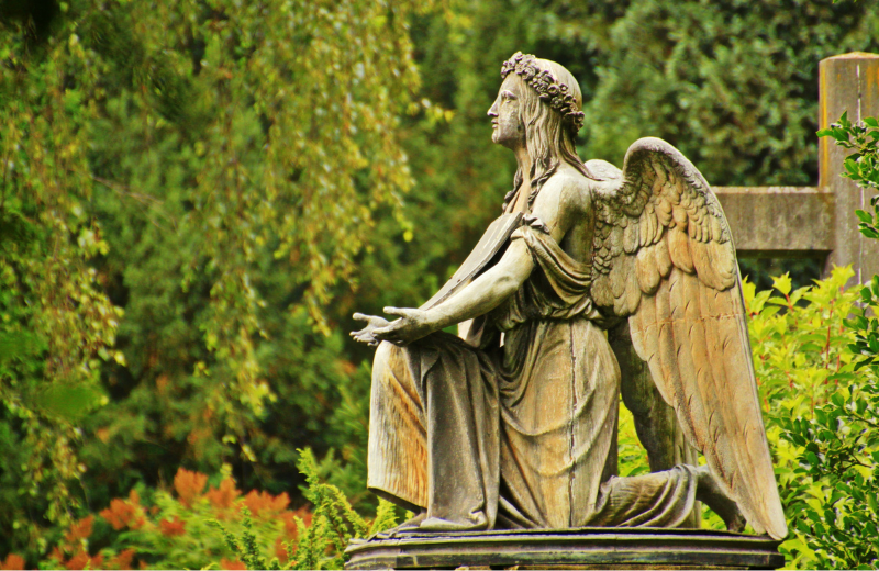 Archangel Raphael kneeling statue