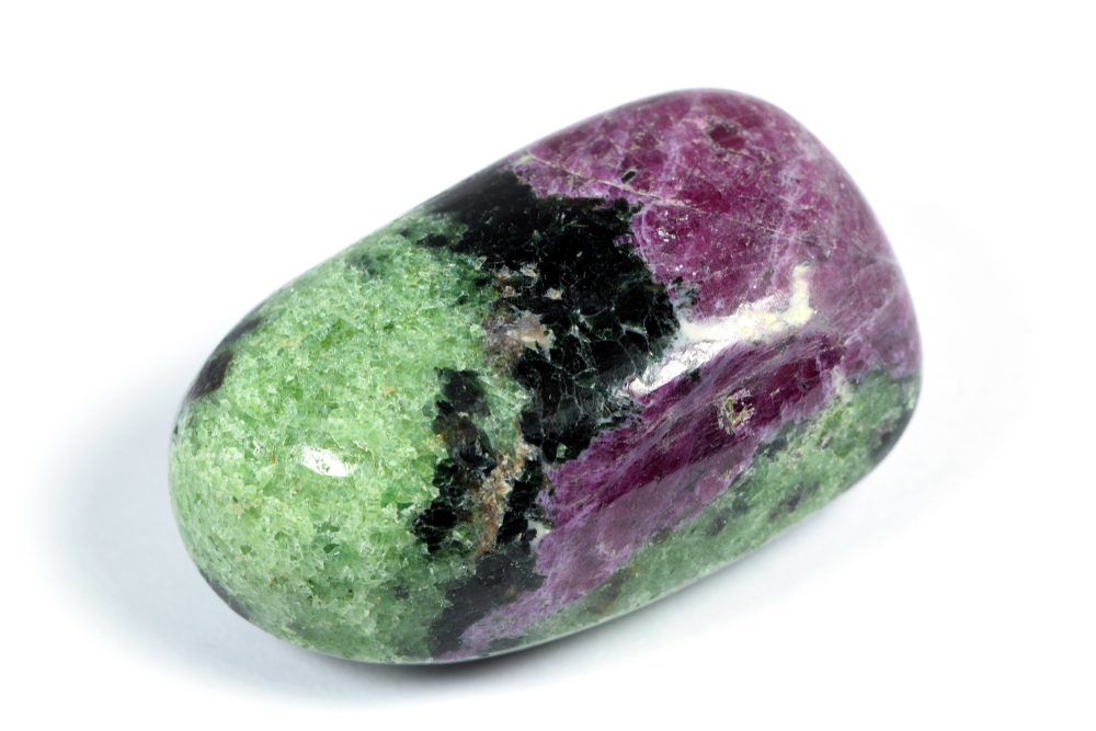 A piece of Zoisite with Ruby on a white background