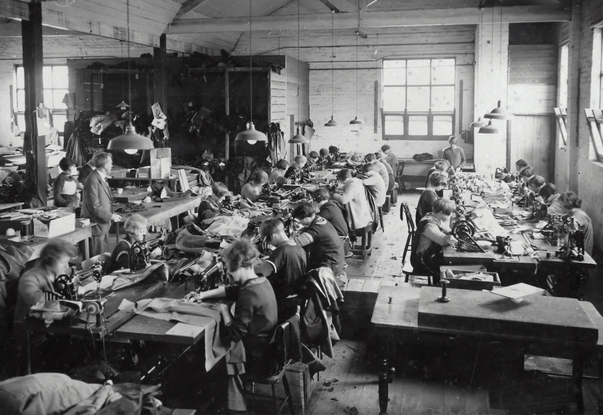Industrial revolution workers in a factory.