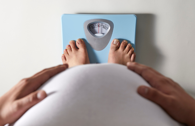 Standing on a weight scale