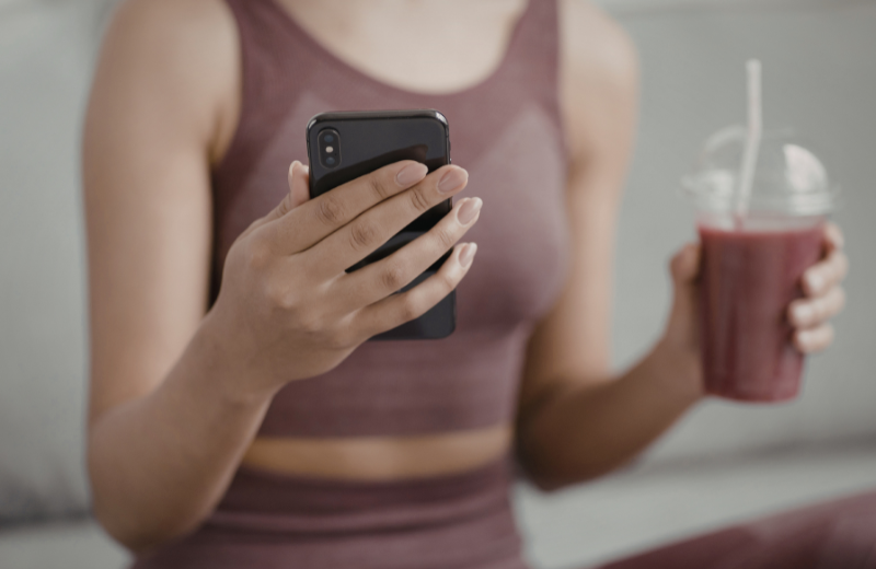 healthy woman holding smoothie
