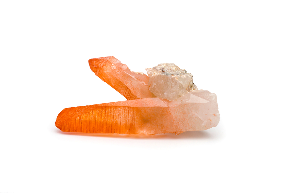 A piece of Tangerine Quartz on a white background