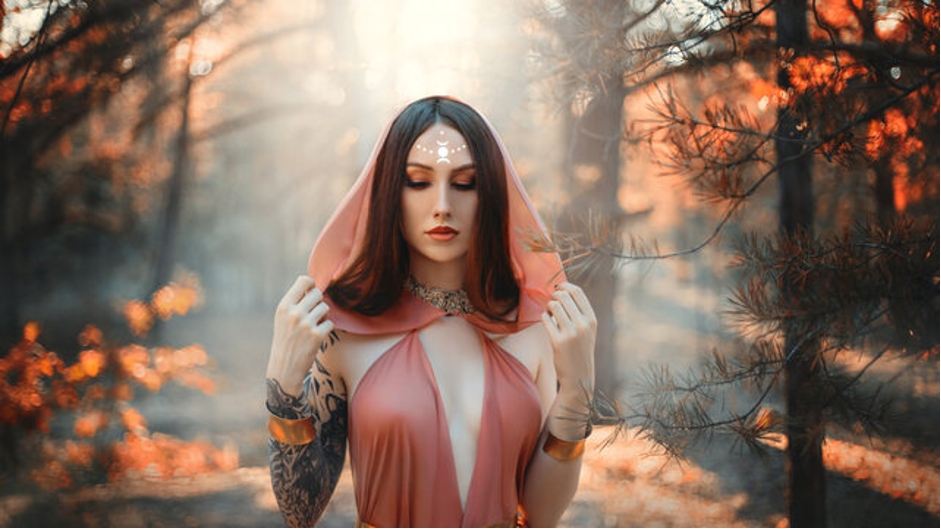 A goddess priestess in a forest.