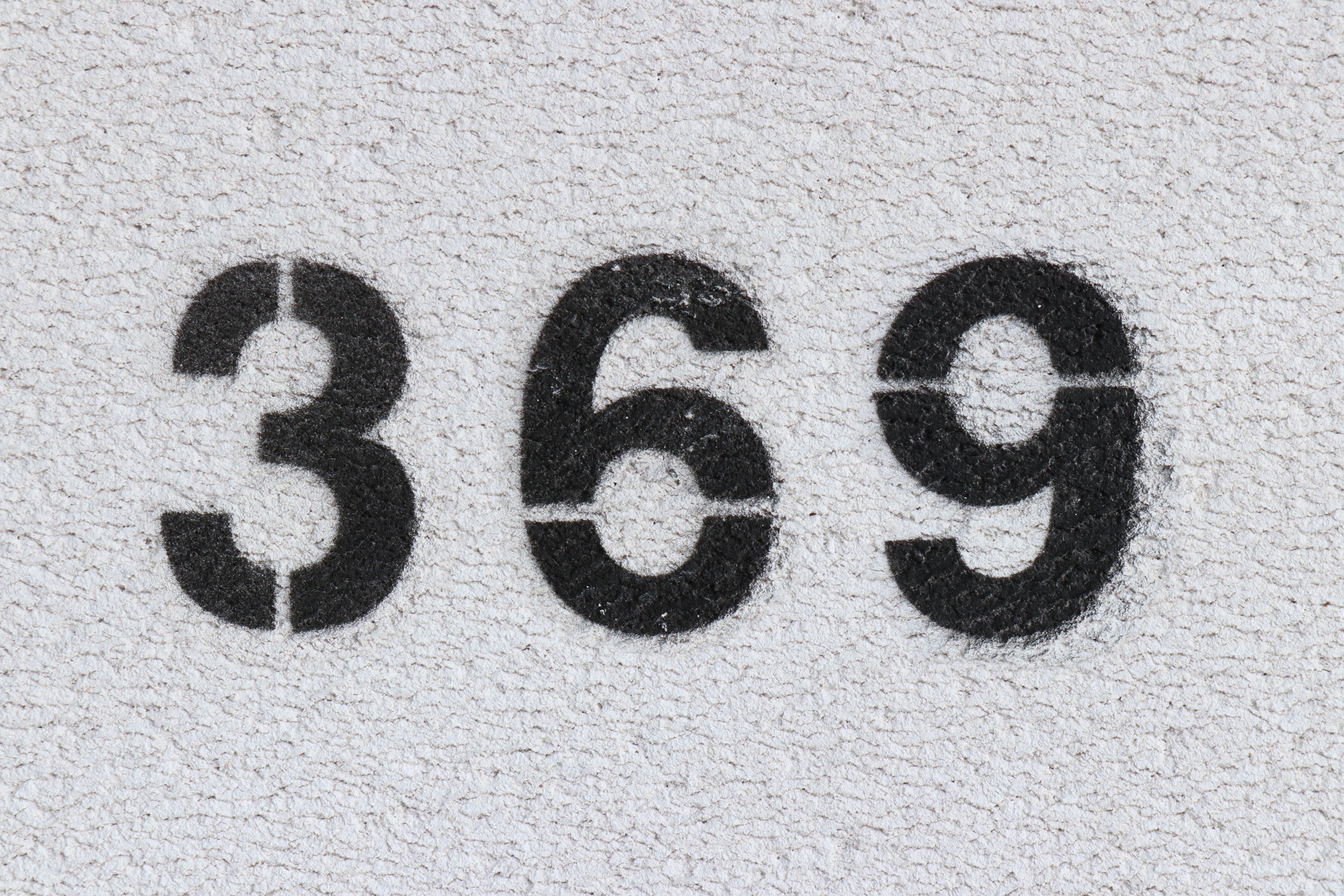 The numbers 3 6 and 9 written in black on a white background
